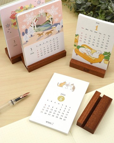 Custom die-cut standing desk calendar shaped like a mason jar with cute hand-drawn pens and crayons