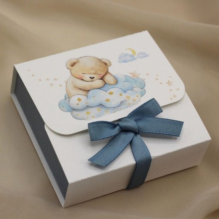 Handmade cream-colored rigid luxury gift box with gold foil monogram and white satin bow