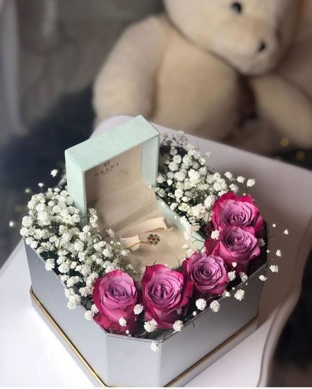 Curated wooden birthday gift hamper containing customized floral diaries, cards and flowers by Keya Meghani